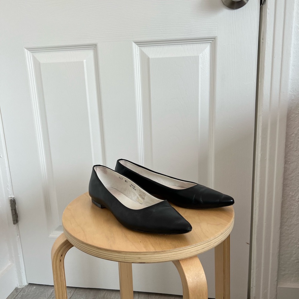 Black leather pointed toe flats